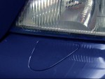 Headlight Wiper Plug Cover installed on S/V70R front bumper